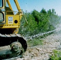 Tractor pulling chain for woody vegetation removal. Photo courtesy of USFS.